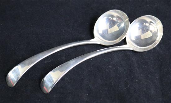 A pair of Edwardian silver Old English pattern sauce ladles by Josiah Williams & Co, London, 1903 & a sterling trefid spoon.